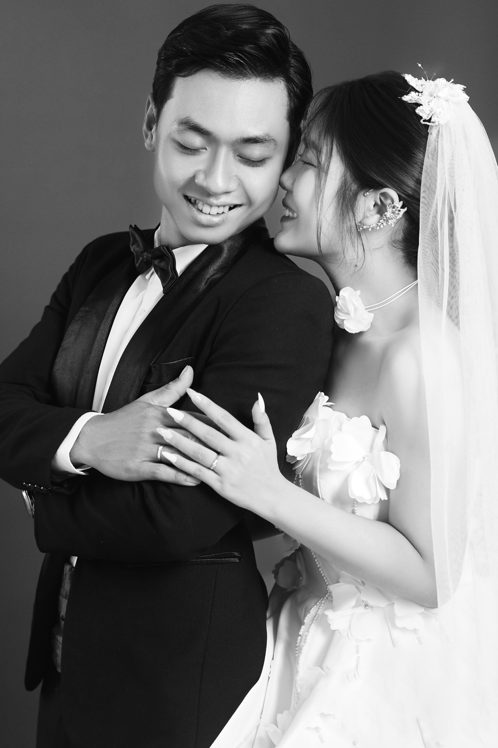 a man and woman are posing for a photo with flowers on their wedding day